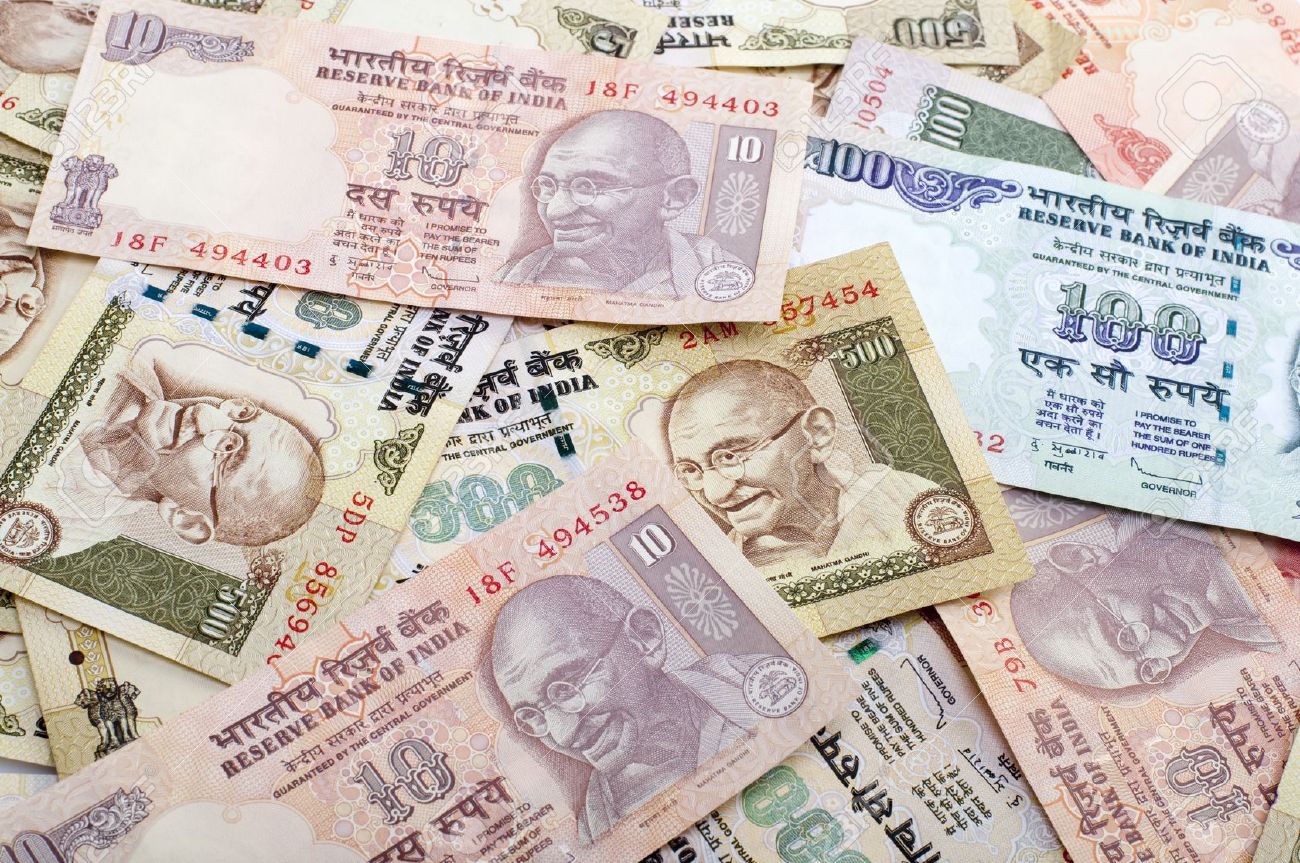 8422535-Indian-Rupee-bank-notes-background-Stock-Photo-indian-money-currency