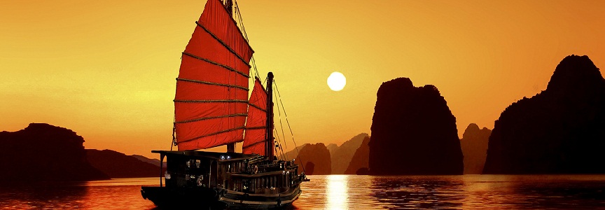 Ha-Long, Vietnam --- Junk in the sea of Halong Bay, a UNESCO World Natural Heritage Site, Karst mountains, romantic sunset, image composition, Vietnam, Asia --- Image by © Gerhard Zwerger-Schoner/imagebroker/Corbis