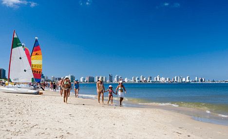 Uruguay, Punta del Este, people walking on beach